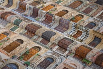 Antique Doors Patterned Digital Print Fabric on Stone Wall